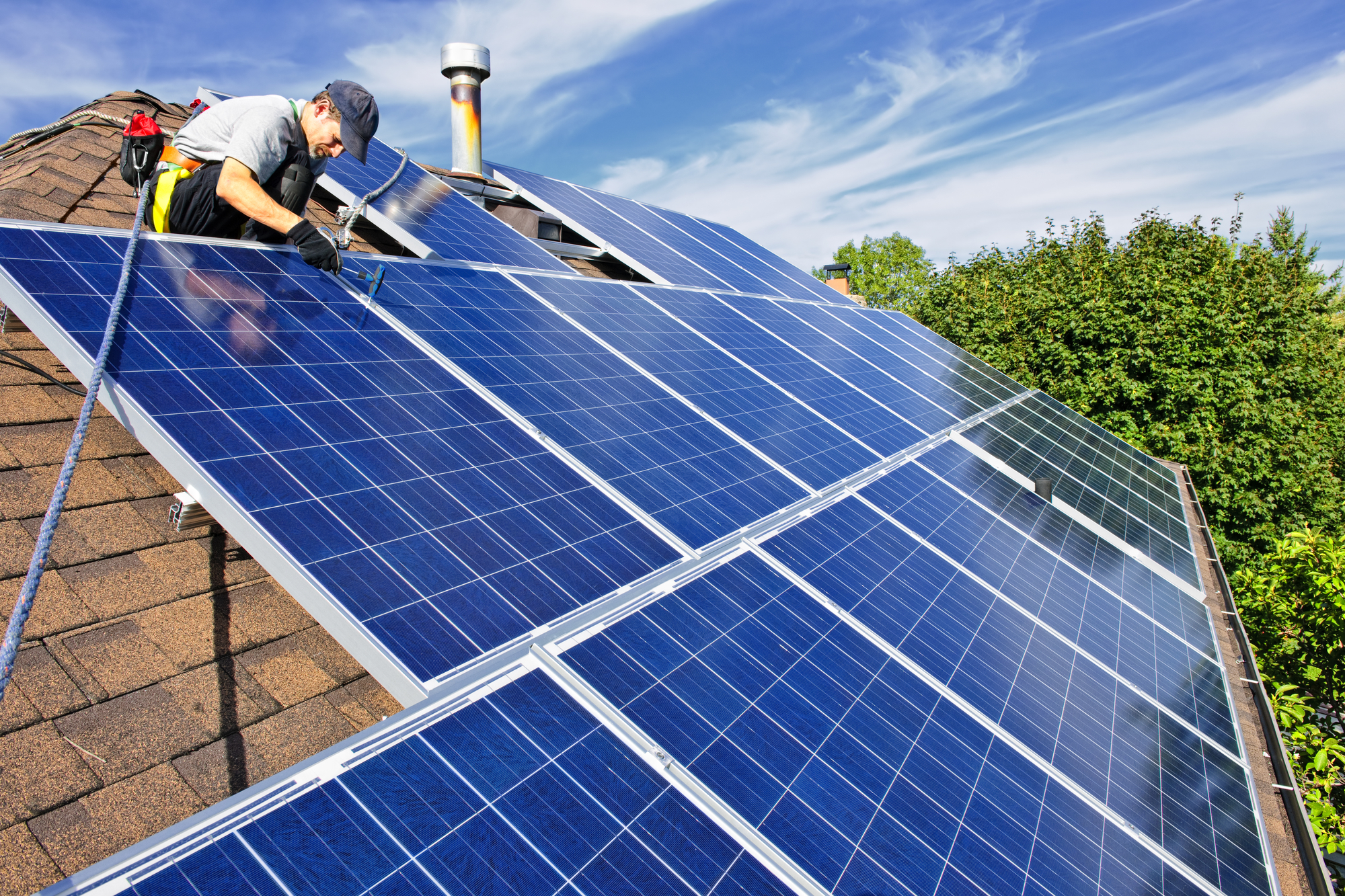 Solar panels producing electricity on a bright day